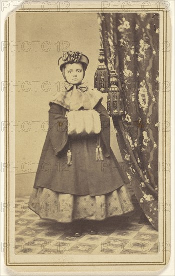 little girl dressed in winter clothing with hand muff, standing; Emery R. Gard, American, active 1856 - 1866, 1865 - 1870