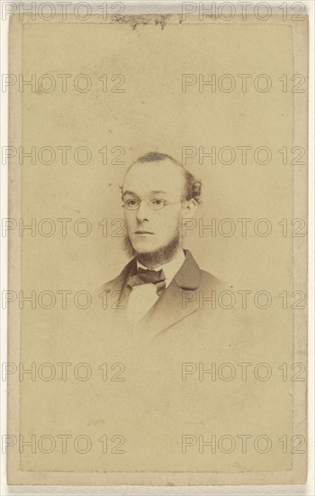 chin-bearded man wearing wire-rimmed glasses, printed in vignette-style; James Cremer & James Dillon; 1870-1875; Albumen silver