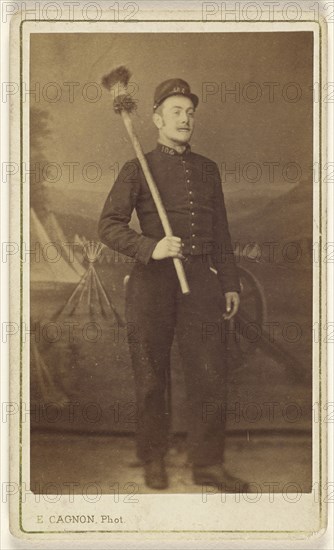 man in uniform standing, with what is possibly a cannon sponge over his shoulder; E. Cagon, French, active Argentina 1860s