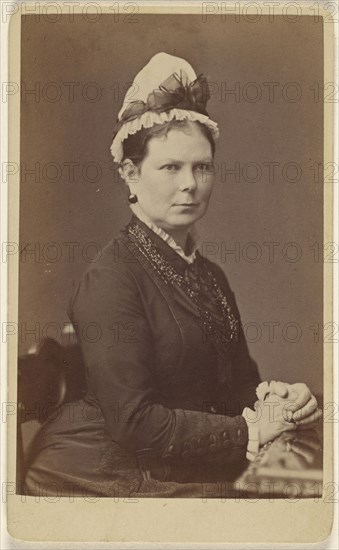 woman wearing a bonnet with a bow, seated with hands together; George Washington Wilson, Scottish, 1823 - 1893, 1862 - 1865