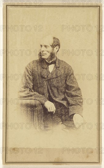 man with long, bushy muttonchops, seated in a chair with tassels; Alexander Gardner, American, born Scotland, 1821 - 1882