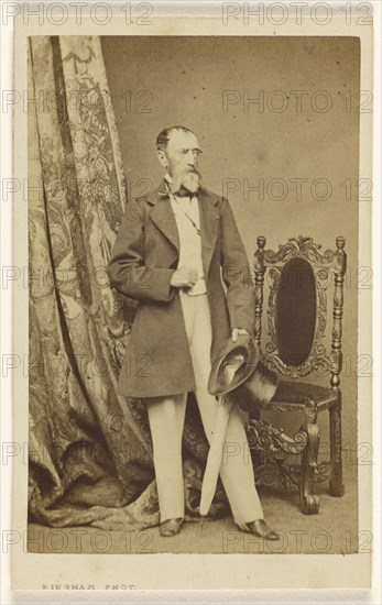 man with full white beard, standing, holding a top hat and umbrella in his left hand; Robert Jefferson Bingham British, 1824