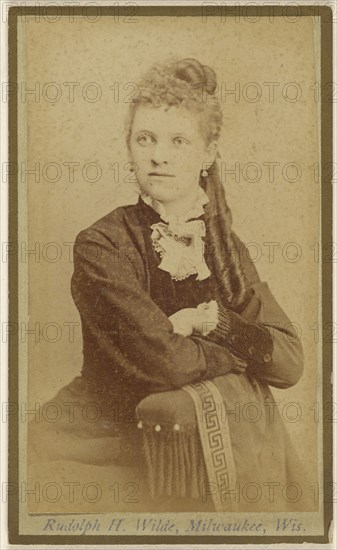 woman seated with arms crossed on chair arm; Rudolph H. Wilde, American, active Milwaukee, Wisconsin 1860s, 1865 - 1875