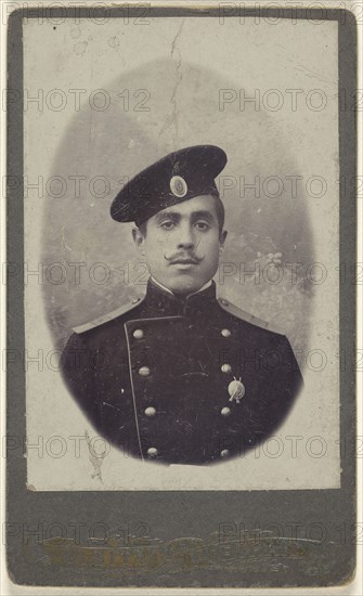 military man with moustache wearing a cap, a pin on his lapel; 1880 - 1885; Albumen silver print