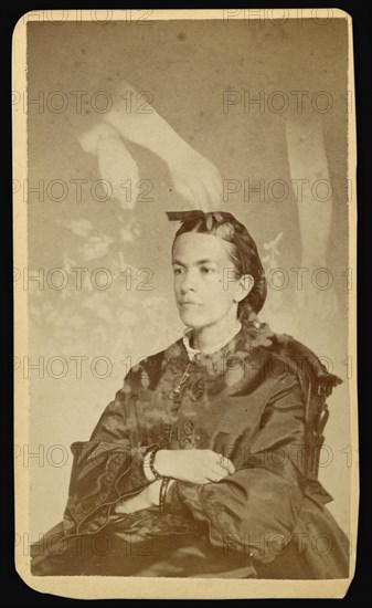 woman seated with arms of a  spirit  over her head; William H. Mumler, American, 1832 - 1884, Boston, Massachusetts, United