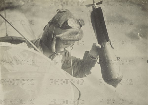 Man in airplane dropping a bomb; Fédèle Azari, Italian, 1895 - 1930, Italy; 1914 - 1918; Gelatin silver print; 11.3 x 16 cm