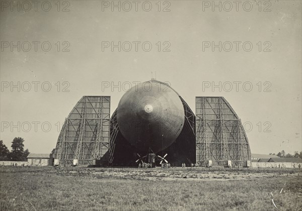 Blimp coming out of hanger; Fédèle Azari, Italian, 1895 - 1930, Milan, Italy; 1914 - 1929; Gelatin silver print; 11.6 x 16.4 cm