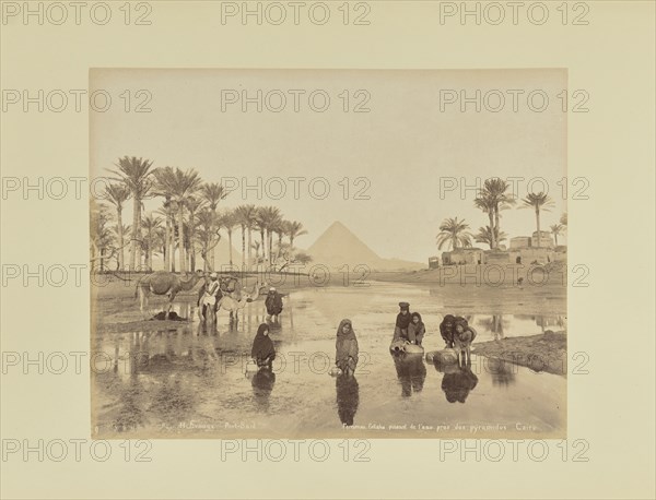 Femmes, Fellahs puisant de l'eau près des pyramides, Caire; Hippolyte Arnoux, French, active 1860s - 1880s, Port Said, Egypt
