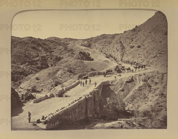 Soldiers and camels crossing bridge; John Burke, British, active 1860s - 1870s, Afghanistan; 1878 - 1879; Albumen silver print