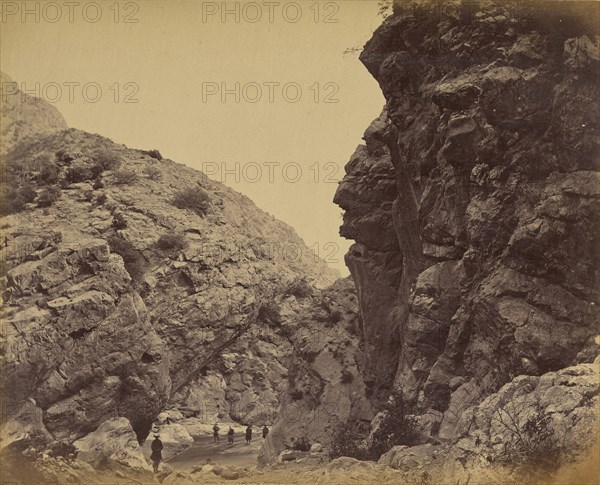 Figures walking path between hills; John Burke, British, active 1860s - 1870s, Afghanistan; 1878 - 1879; Albumen silver print