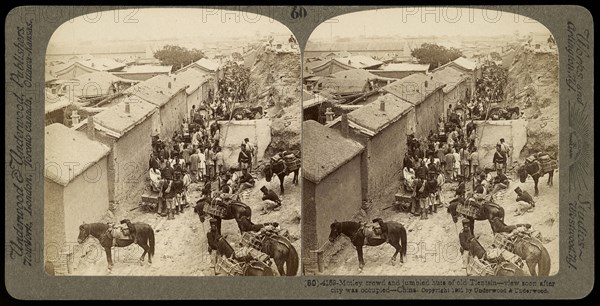 Motley crowd and jumbled huts of old Tientsin- view soon after city was occupied- China, Ricalton, James, Underwood