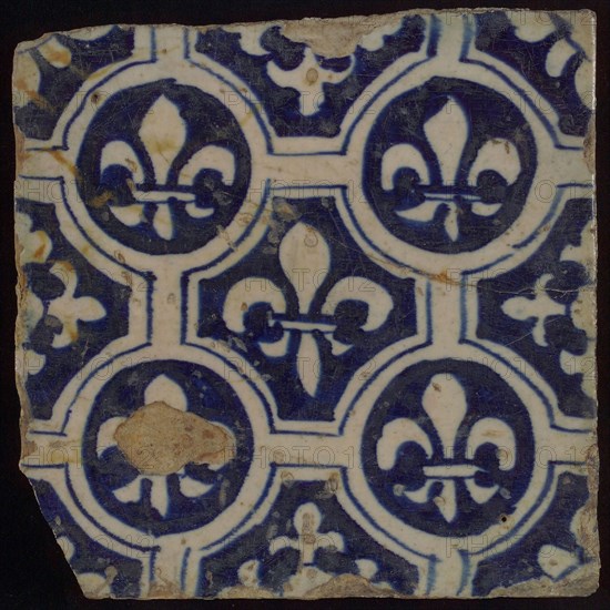 Two-tone tile, blue on white background, four circles with white French lily around central ornament with lily, wall tile