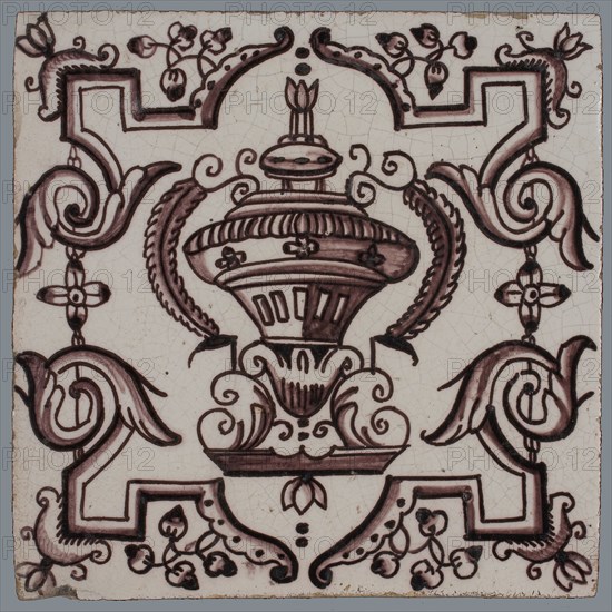 Tile, purple on white, vase with round floral ornaments, framed by régence decoration, wall tile tile sculpture ceramic