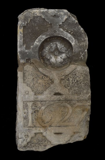 Fragment of gate Walloon church, former St. Sebastian chapel and Scottish church with date 1627, facing brick fragment sculpture