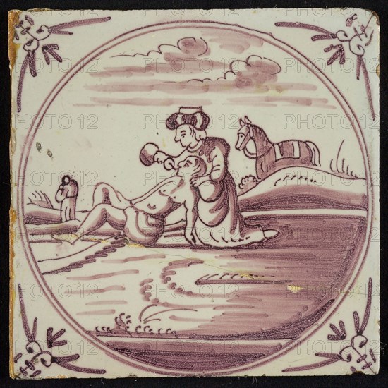 Scene tile, good Samaritan gives lying jew to drink, corner motif of ox-head, wall tile tile sculpture ceramic earthenware glaze