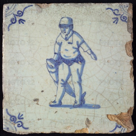 Occupation tile, blue with man dragging big fish, salmon fisherman, Corner motif oxen head, wall tile tile sculpture ceramic