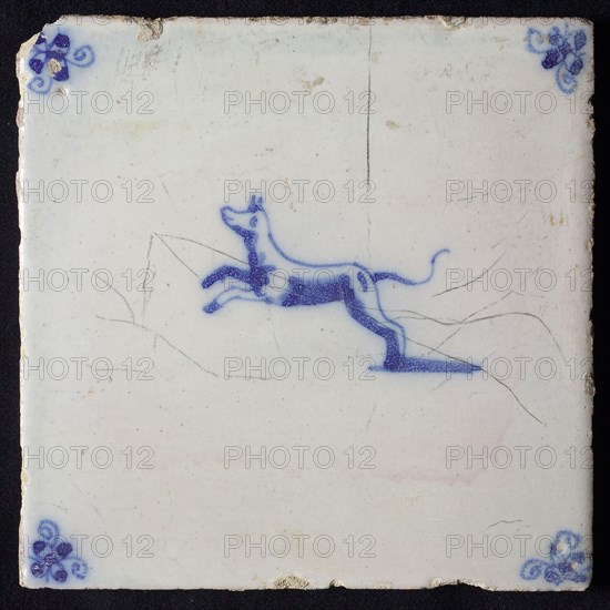 Animal tile, jumping dog to the left, in blue on white, corner motif spider, wall tile tile sculpture ceramic earthenware glaze