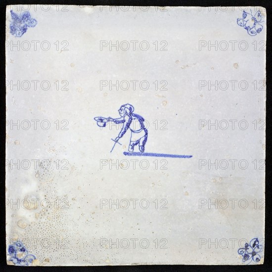 Figure tile, blue with beggar without lower legs, holds his hat, corner motif spider, wall tile tile sculpture ceramic