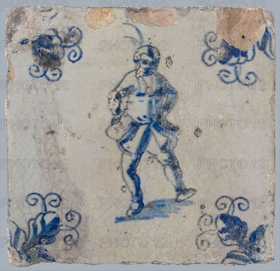 Figure tile, blue with dancing man with beret with plume on the head, corner motif, wall tile tile sculpture ceramic earthenware