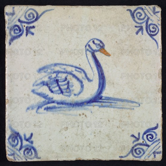 Animal tile, bird in water to the right in orange and blue on white, corner motif ox's head, wall tile tile sculpture ceramic