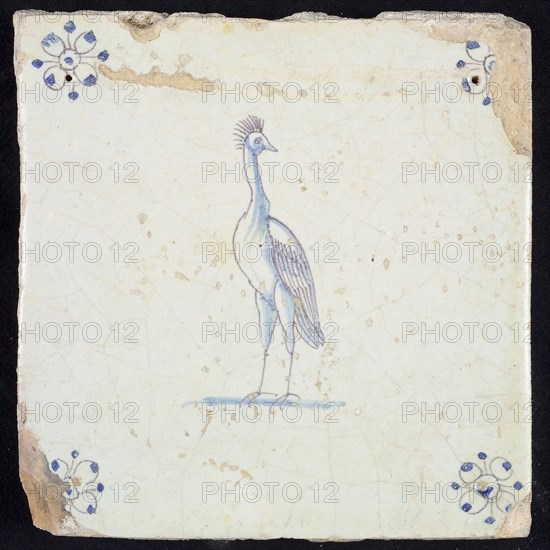 Animal tile, standing crane to the left, in purple and blue on white, corner motif spider, wall tile tile sculpture ceramic