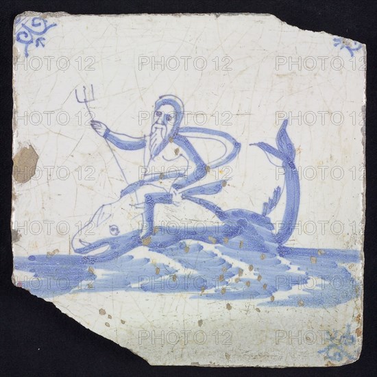 Sea Pewter, man with trident sitting on dolphin in running water to the left, in blue on white, corner motif oxen head, wall