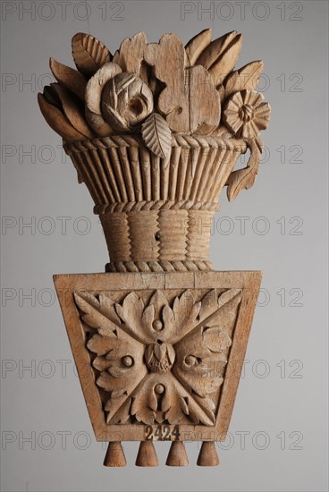 Carved wooden basket with flowers, fragment of paneling, ornament wood carving sculpture footage wood