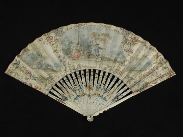 Folding fan with carved and painted ivory frame, both front and rear painted parchment leaf with lady and lord in landscape