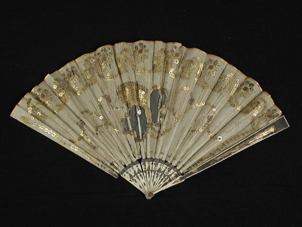 Folding fan with bone frame with foil, fan blade of cream-colored silk with tulle incrustation and gold colored sequins, folding