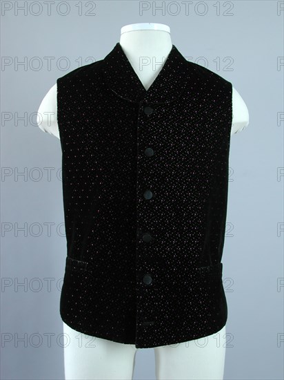 Mens jacket in black velvet with pink mules and yellow dots, high closed scarf collar, back of gray-brown cotton with buckle