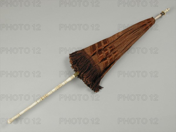 Carriage umbrella with brown silk trim with brown-black fringed edge, carved, leg handle, Carriage parasol clothing accessory