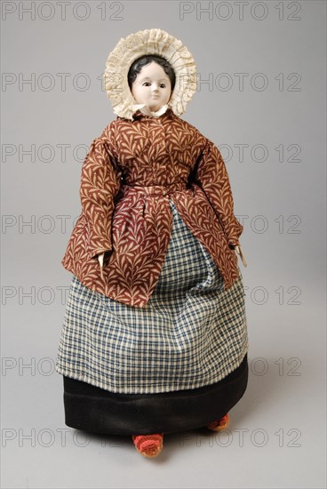 mw. Andres-Van Embden, Dollhouse doll, papier-mâché head with inlaid brown glass eyes, wooden forearms, fabric body and legs