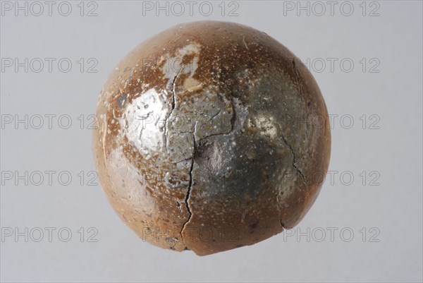 Stone sphere with brown glaze, marble or ball, marble toy relaxant bullet ammunition soil find ceramic stoneware clay engobe
