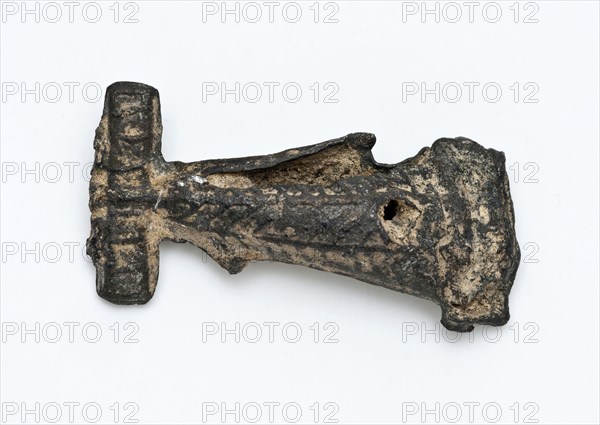 Tin flute or artefact with simple relief decoration, artifact soil find tin metal, cast Pointed object of tin. Decorated
