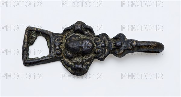 Coat hook or coat closure, cherub head on front, with eye and hook at ends, closure clothing accessory clothing soil find copper
