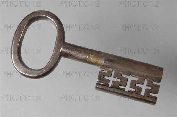 Iron key with oval eye, hollow key handle and cruciform beards in beard, key iron value iron, hand forged Key with oval eye