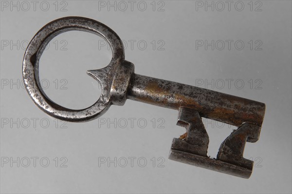 Iron key with heart-shaped eye, hollow key handle and cruciform beards in beard, key iron iron, hand forged Key with heart