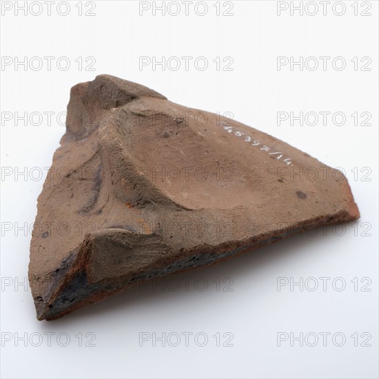 Fragment of red earthenware, partly with glaze, fragment crockery holder kitchen utensils earthenware ceramics earthenware glaze