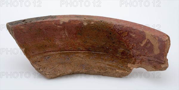 Fragment of red earthenware, partly glazed, fragment crockery holder kitchen utensils earthenware ceramics earthenware glaze