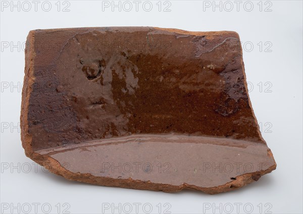 Fragment of red earthenware, partly glazed, fragment crockery holder kitchen utensils earthenware ceramics earthenware glaze