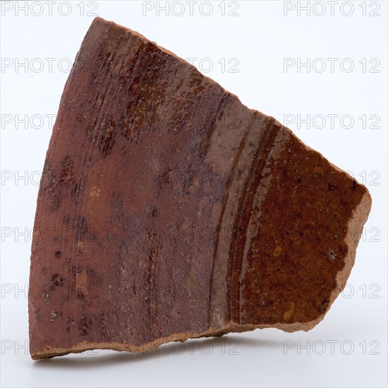 Fragment of red earthenware, partly glazed, fragment crockery holder kitchen utensils earthenware ceramics earthenware glaze