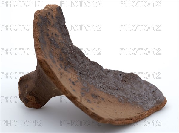 Fragment of red earthenware, partly with glaze, fragment crockery holder kitchen utensils earthenware ceramics pottery glaze