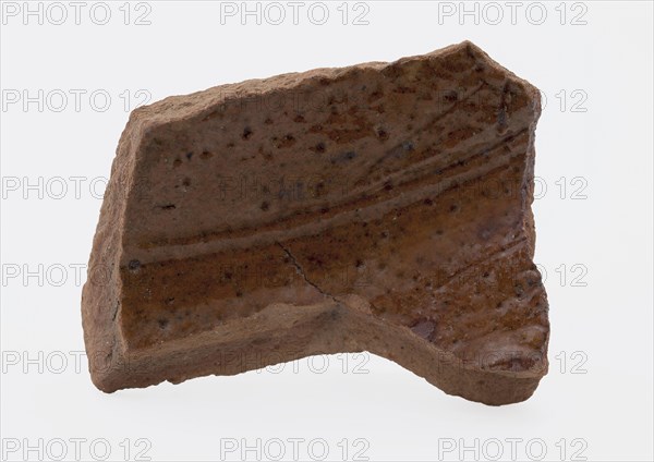 Fragment of red earthenware, partly glazed, fragment crockery holder kitchen utensils earthenware ceramics earthenware glaze