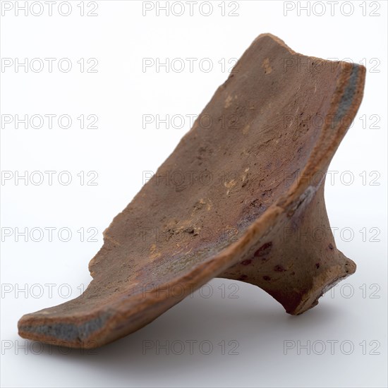 Fragment of red earthenware, partly with glaze, fragment crockery holder kitchen utensils earthenware ceramics earthenware glaze