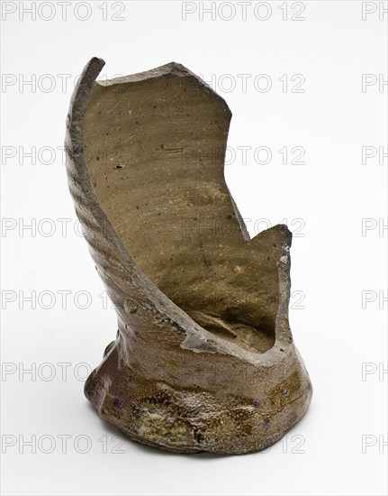 Foot of stoneware drink jug or cup of brown and gray mottled glaze, cup drinking utensils tableware holder fragment soil found