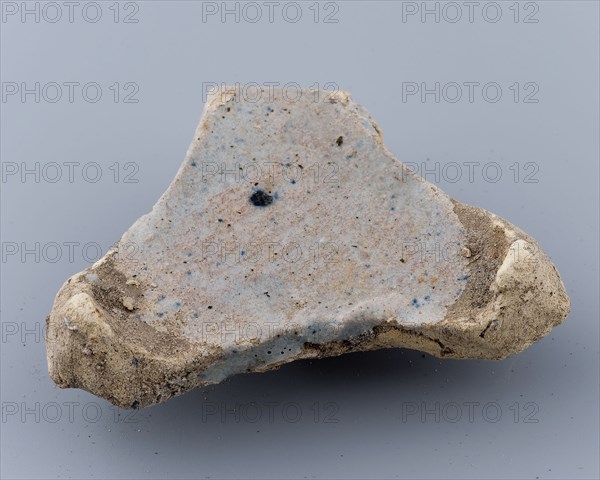 Fragment of prune, soil found ceramic earthenware glaze lead glaze, baked Triangular flat object with points on the three