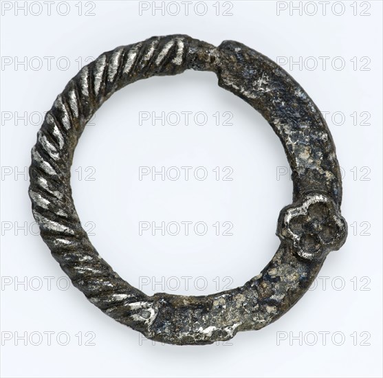 Annular buckle with twisted edge and small rosette, ornamental buckle, buckle fastener component soil find tin? silver? metal