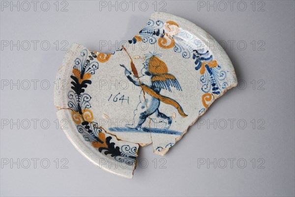 Majolica plate, yellow and blue on white, Cupid with sash, aigrette border, dated 1641, plate crockery holder soil find ceramic