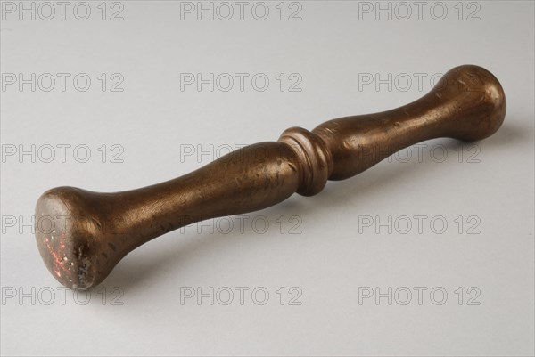 Bronze stamper, pestle tools equipment bronze, cast Pestle: round stem with central node. Bolls on both sides of node.