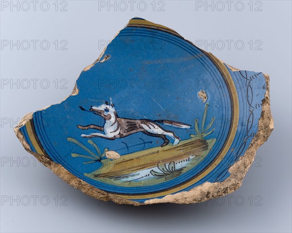 Mirror fragment of majolica plate, running dog on blue ground, plate dish crockery holder soil find ceramic earthenware glaze